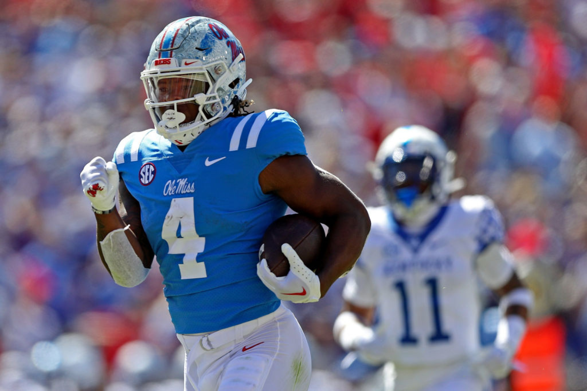 Quinshon Judkins #4 of the Mississippi Rebels carries the ball during the first half against the Kentucky Wildcats