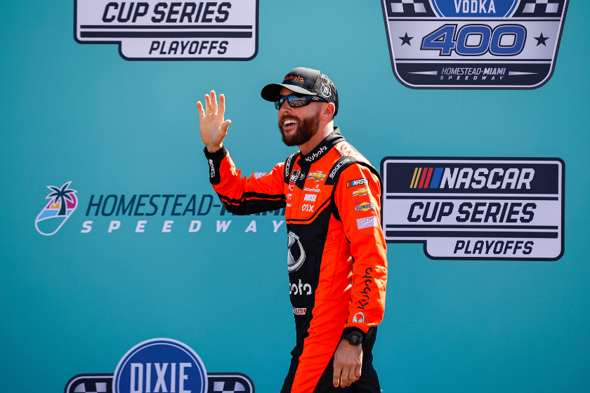 Ross Chastain waves to fans as he walks onstage during driver intros prior to the 2022 Dixie Vodka 400 at Homestead-Miami Speedway