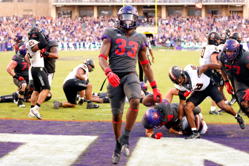 Kendre Miller #33 of the TCU Horned Frogs reacts following his game winning touchdown run against the Oklahoma State Cowboys
