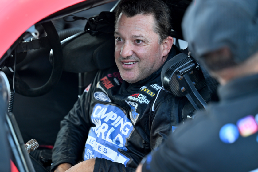 Tony Stewart talks with his crew prior to the start of the SRX qualifying race at Sharon Speedway on July 23, 2022