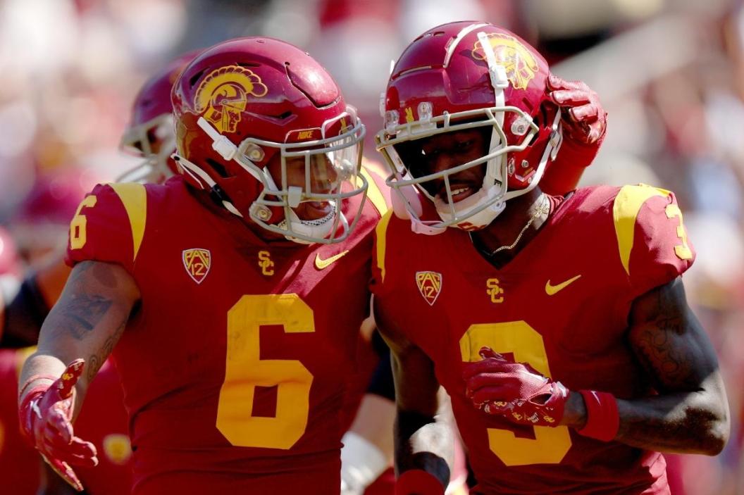 : Jordan Addison #3 of the USC Trojans celebrates his touchdown with Austin Jones #6, to take a 7-0 lead over the Rice Owls