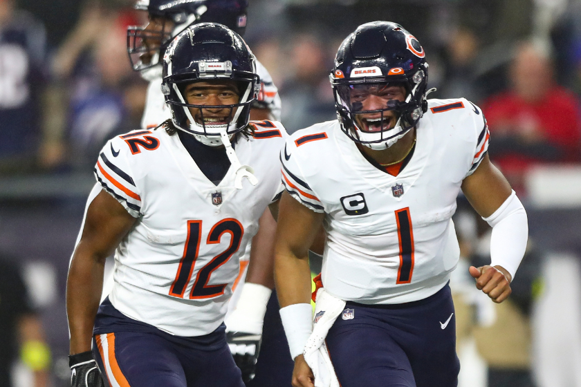Justin Fields #1 of the Chicago Bears celebrates with Velus Jones Jr. #12 after scoring a touchdown during an NFL football game against the New England Patriots 