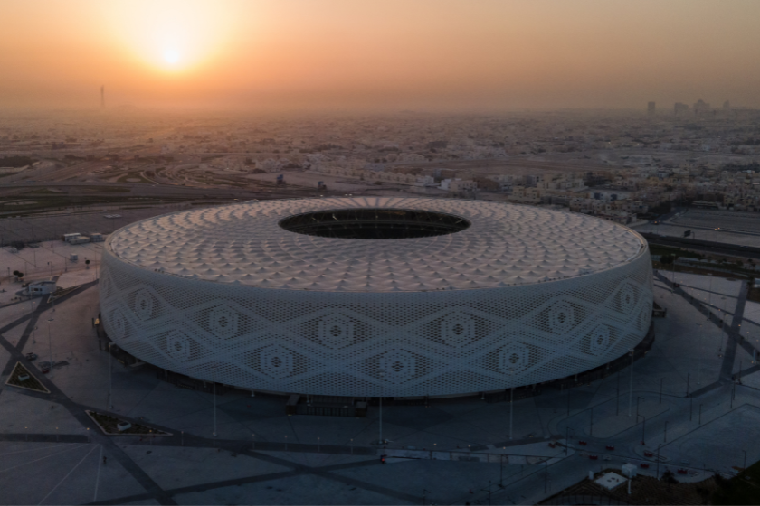 An aerial view of Al Thumama stadium at sunset on June 22, 2022 in Doha, Qatar. Designed by the architect Ibrahim M. Jaidah, the stadium's bold, circular form reflects the gahfiya - a traditional woven cap adorned by men and boy