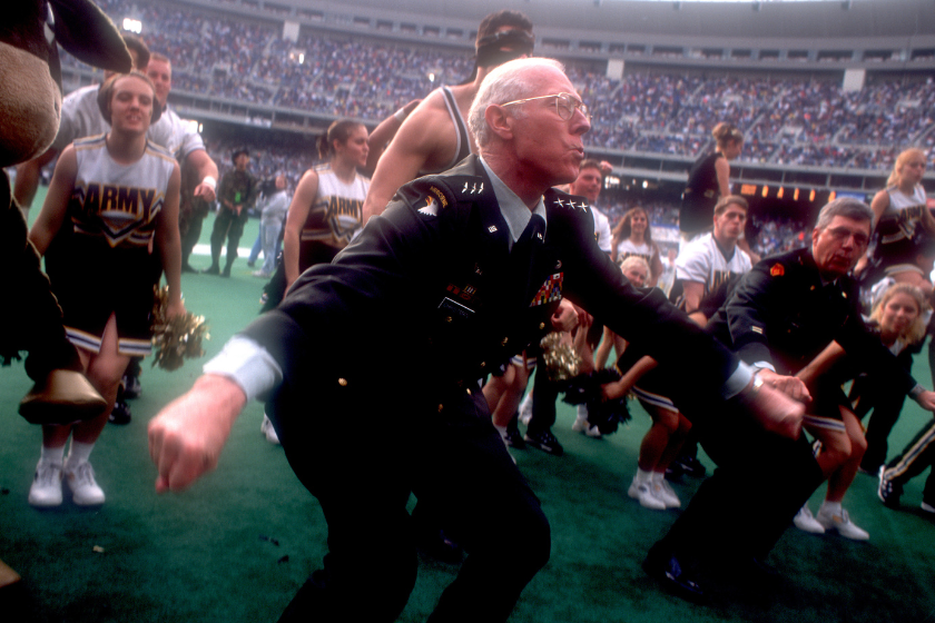The commander of West Point helps rally the crowd during half-time f the 1999 Army-Navy Game