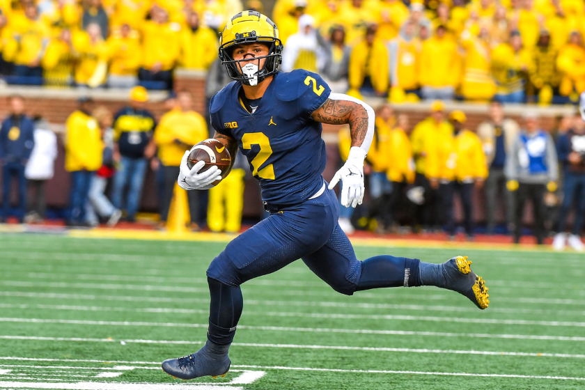 Blake Corum #2 of the Michigan Wolverines runs with the ball during the first half of a college football game against the Penn State Nittany Lions at Michigan Stadium