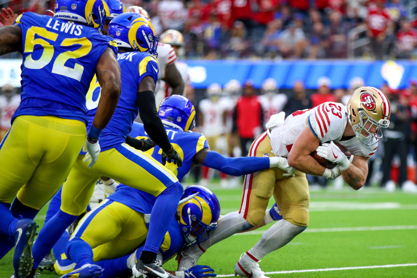 an Francisco 49ers running back Christian McCaffrey, #23, breaks away from the Rams defense in the fourth quarter. McCaffrey threw for a touchdown, caught a touchdown pass and ran for a touchdown 