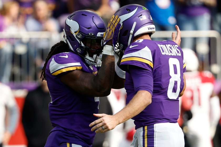 Kirk Cousins #8 of the Minnesota Vikings and Dalvin Cook #4 celebrate a touchdown during the second quarter against the Arizona Cardinals