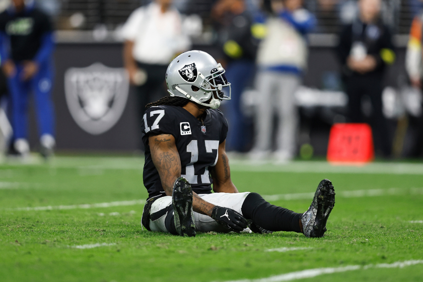 Davante Adams #17 of the Las Vegas Raiders reacts as he sits on the ground during an NFL game between the Las Vegas Raiders and the Indianapolis Colts