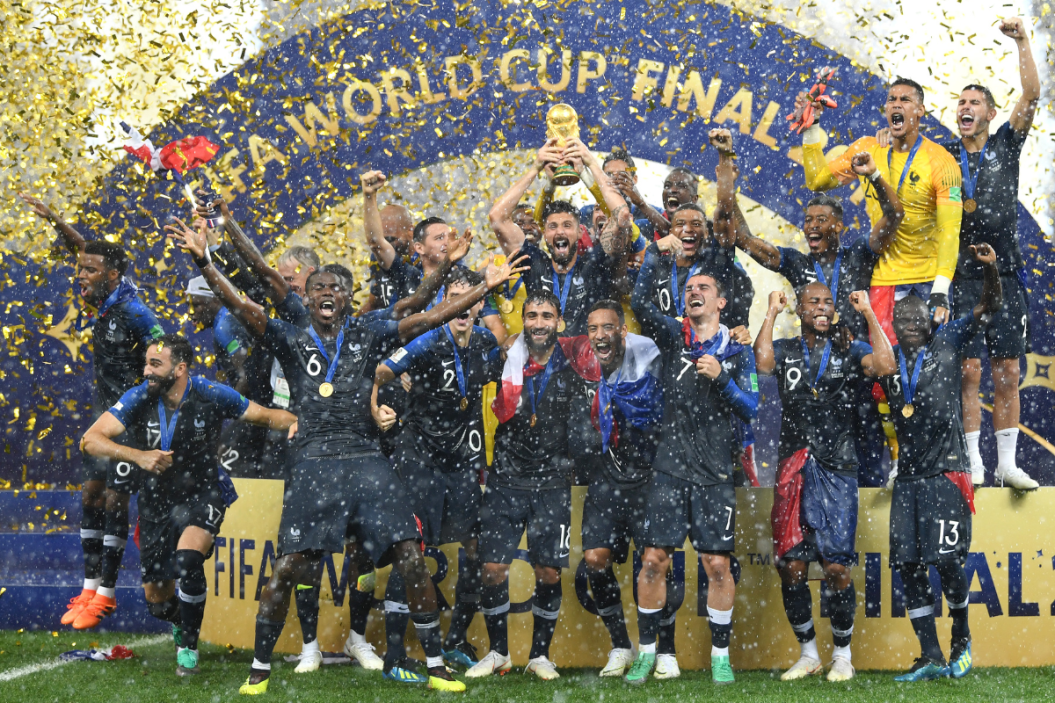 Hugo Lloris and Olivier Giroud of France lift the World Cup trophy to celebrate with teammates after the 2018 FIFA World Cup Final between France and Croatia at Luzhniki Stadium