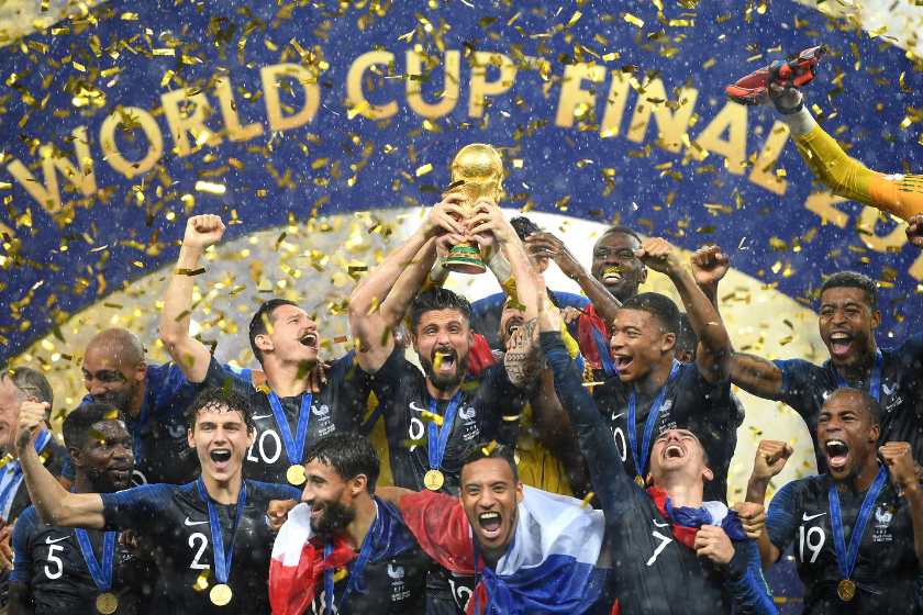 Olivier Giroud of France celebrates with the World Cup Trophy and his teammates following his sides victory in the 2018 FIFA World Cup Final between France and Croatia at Luzhniki Stadium