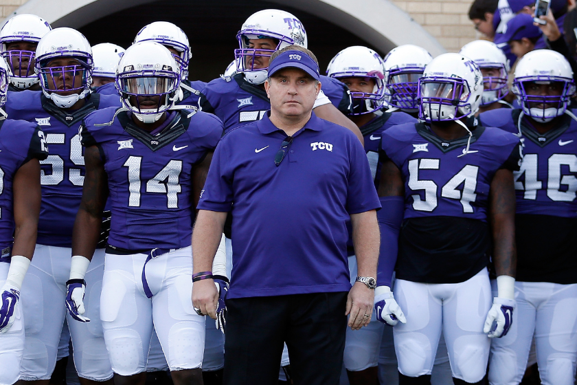 Head coach Gary Patterson of the TCU Horned Frogs leads his team onto the field before the Big 12 college football game against the Iowa State Cyclones