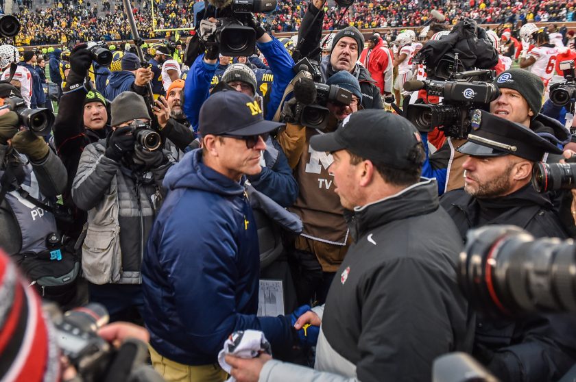 Jim Harbaugh and Ryan Day shake hands in 2019.