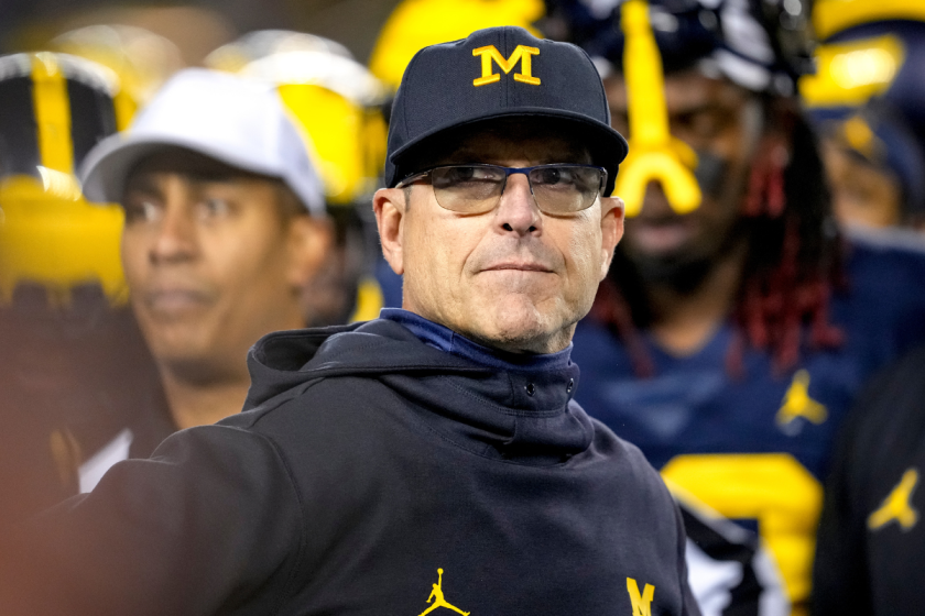 Head coach Jim Harbaugh of the Michigan Wolverines looks on against the Michigan State Spartans