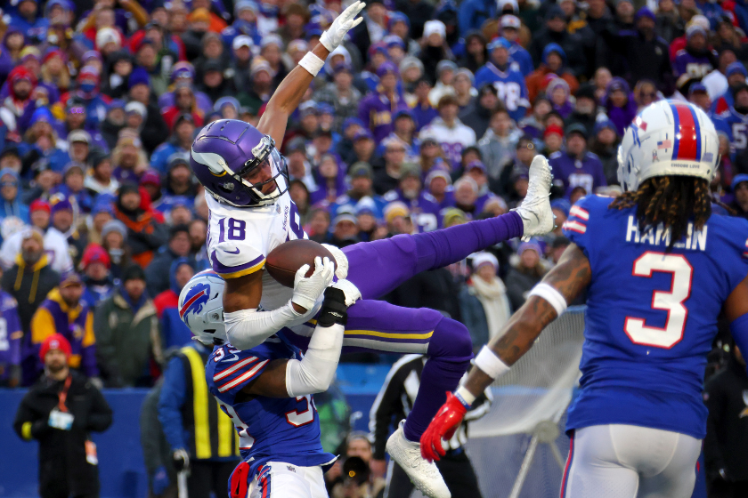 Justin Jefferson #18 of the Minnesota Vikings catches a pass in front of Cam Lewis #39 of the Buffalo Bills during the fourth quarter at Highmark Stadium