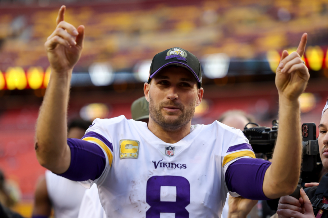 Kirk Cousins #8 of the Minnesota Vikings celebrates after the Wikings defeated the Washington Commanders 20-17 at FedExField