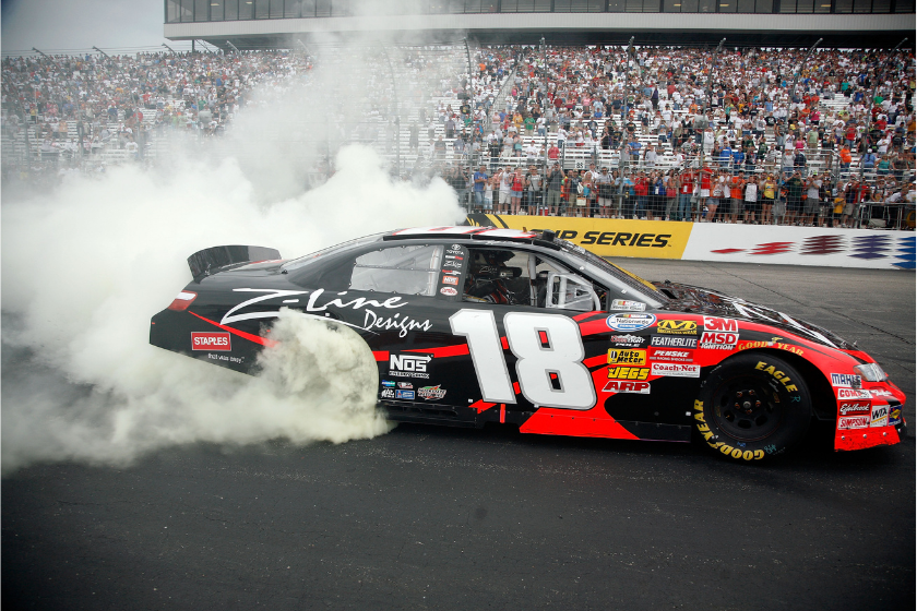 Kyle Busch performs a burnout to celebrate winning the 2010 New England 200 at New Hampshire Motor Speedway