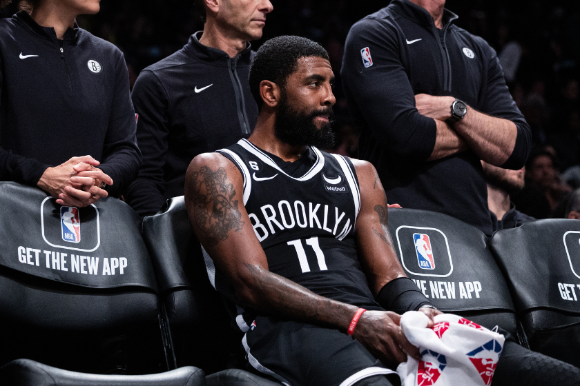 Kyrie Irving #11 of the Brooklyn Nets looks on from the bench during the fourth quarter of the game against the Chicago Bulls