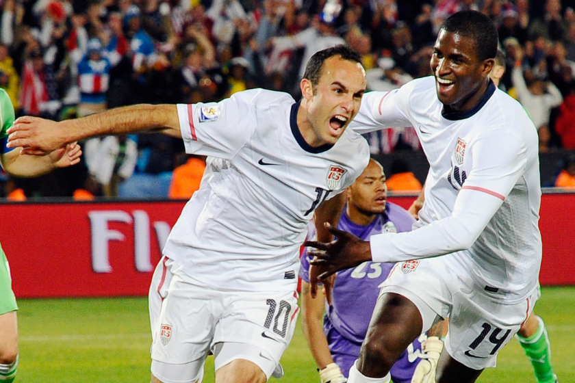  Landon Donovan of the United States celebrates with teammate Edson Buddle after scoring the winning goal that sends the USA through to the second round during the 2010 FIFA World Cup South Africa Group C 