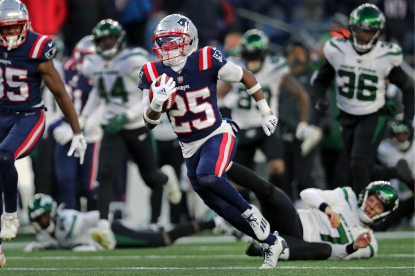 New England Patriots CB Marcus Jones breaks free for a 85-yard game-winning punt return for a touchdown against the New York Jets. 