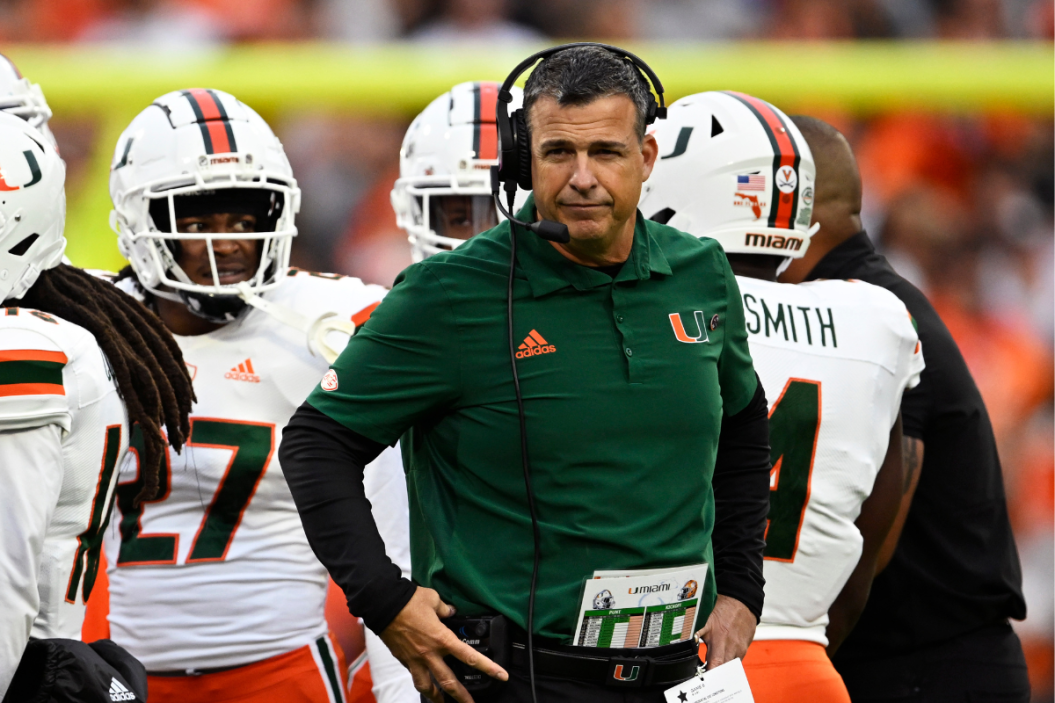 Head coach Mario Cristobal of the Miami Hurricanes stands on the field during a time out against the Clemson Tigers