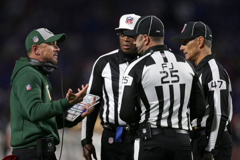 Head coach Matt LaFleur of the Green Bay Packers has a discussion with officials during the third quarter against the Buffalo Bills at Highmark Stadium