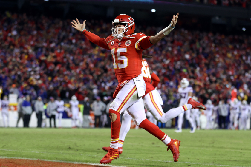 Patrick Mahomes #15 of the Kansas City Chiefs celebrates a touchdown scored by Tyreek Hill #10 against the Buffalo Bills during the fourth quarter in the AFC Divisional Playoff game