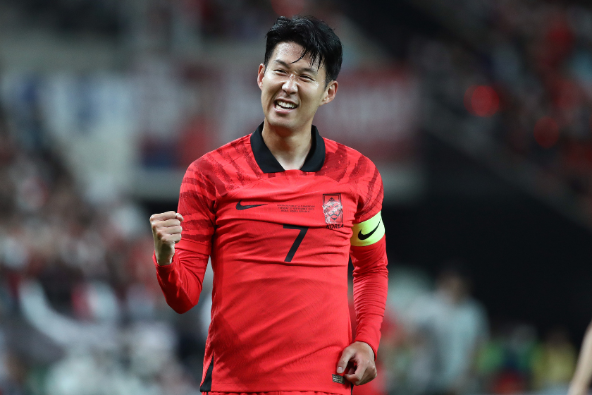 on Heung-Min of South Korea celebrates after scoring his team's first goal during the South Korea v Cameroon