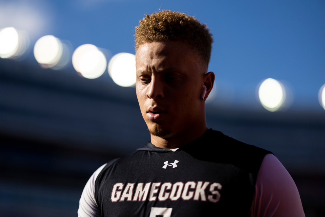 Spencer Rattler #7 of the South Carolina Gamecocks heads to the locker room before the start of a game against the Florida Gators at Ben Hill Griffin Stadium