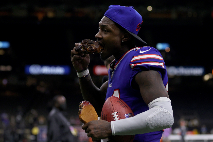Stefon Diggs #14 of the Buffalo Bills eats a turkey leg as he walks off the field after a win over the New Orleans Saints at Caesars Superdome