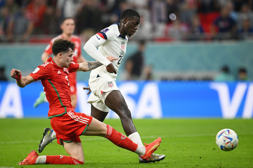 Timothy Weah of United States scores their team's first goal during the FIFA World Cup Qatar 2022 Group B match between USA and Wales