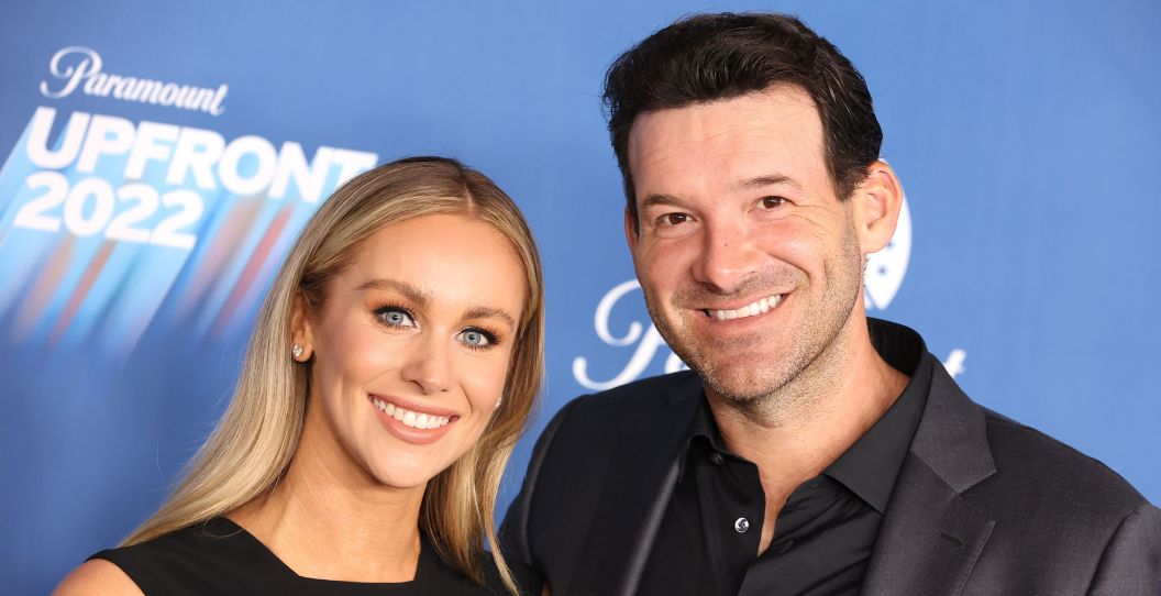 Tony Romo and his wife, Candice, pose for a photo.