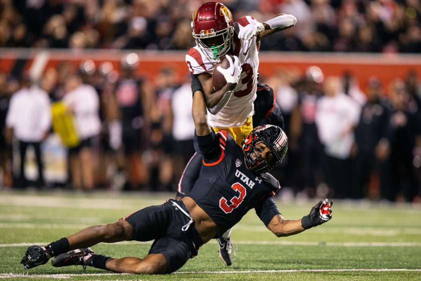 Mohamoud Diabate #3 of the Utah Utes brings down Jordan Addison #3 of the USC Trojans with one hand during the second half of their game