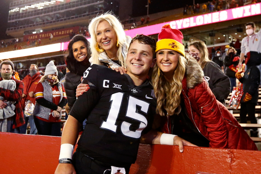 Quarterback Brock Purdy #15 of the Iowa State Cyclones celebrates with his mother Carrie Purdy, left, and sister Whitney Purdy after winning 37-30 over the Oklahoma Sooners