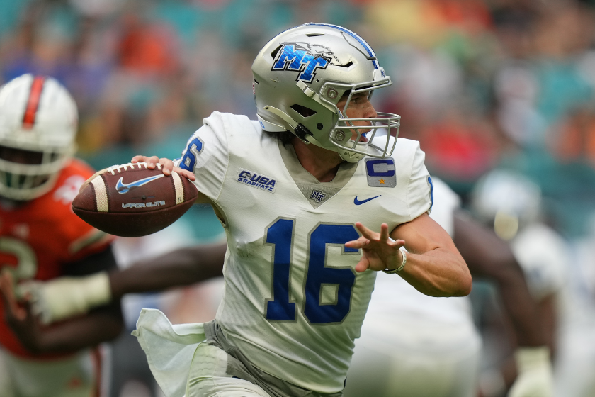 Quarterback Chase Cunningham (16) makes a throw on the run during the game between the Middle Tennessee Blue Raiders and the Miami Hurricanes.