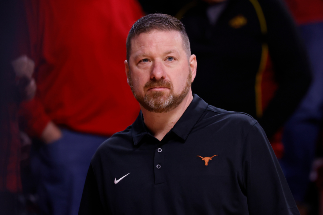 Head coach Chris Beard of the Texas Longhorns coaches from the bench in the first half of play at Hilton Coliseum