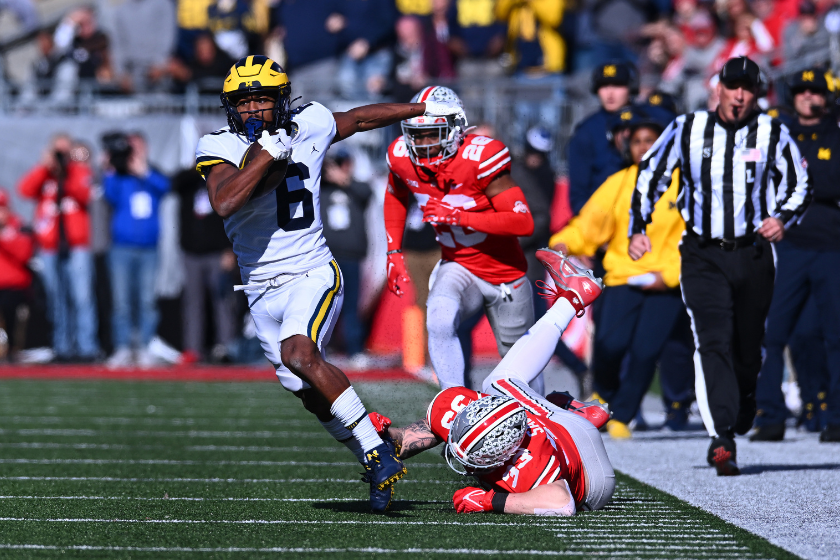 Cornelius Johnson #6 of the Michigan Wolverines runs with the ball during the second quarter of a game against the Ohio State Buckeyes at Ohio Stadium