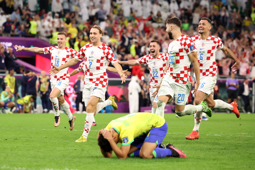 Croatia players celebrate their win via a penalty shootout as Marquinhos of Brazil react during the FIFA World Cup Qatar 2022 quarter final match between Croatia and Brazil 
