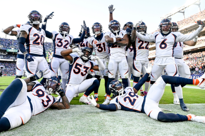 Justin Simmons (31) of the Denver Broncos celebrates the first of his two interceptions against the Baltimore Ravens with teammates during the third quarter at M&T Bank Stadium
