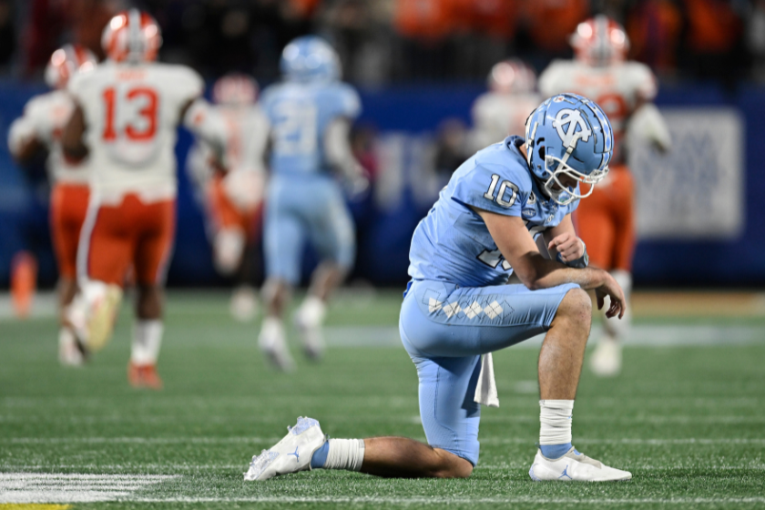 Drake Maye #10 of the North Carolina Tar Heels reacts after throwing an interception that lead to a Clemson Tigers touchdown in the third quarter during the ACC Championship game