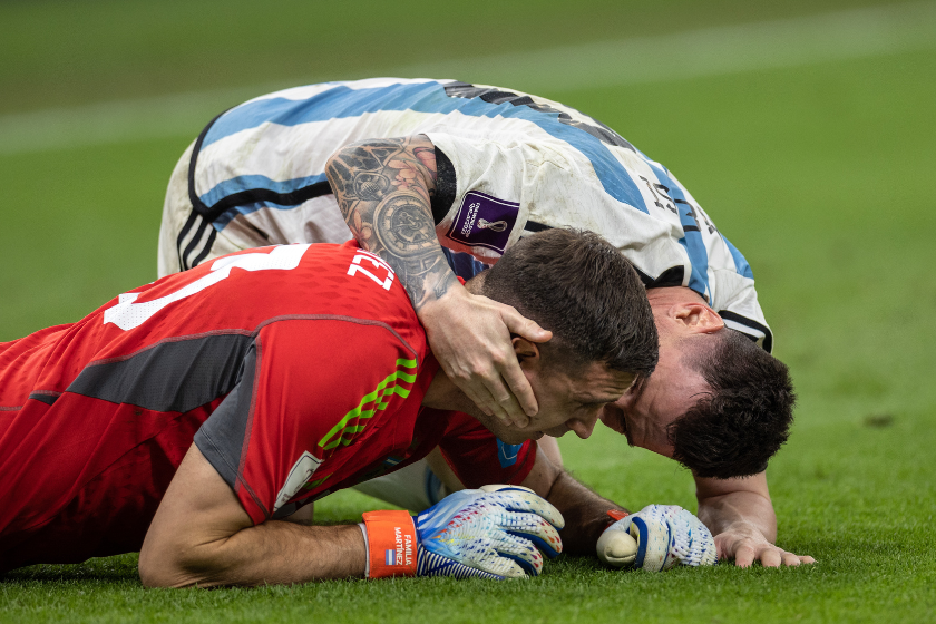 Lionel Messi of Argentina hugs Argentina goalkeeper Emiliano Martinez as Argentina win on penalties during the FIFA World Cup Qatar 2022 quarter final match between Netherlands (2) and Argentina (2)