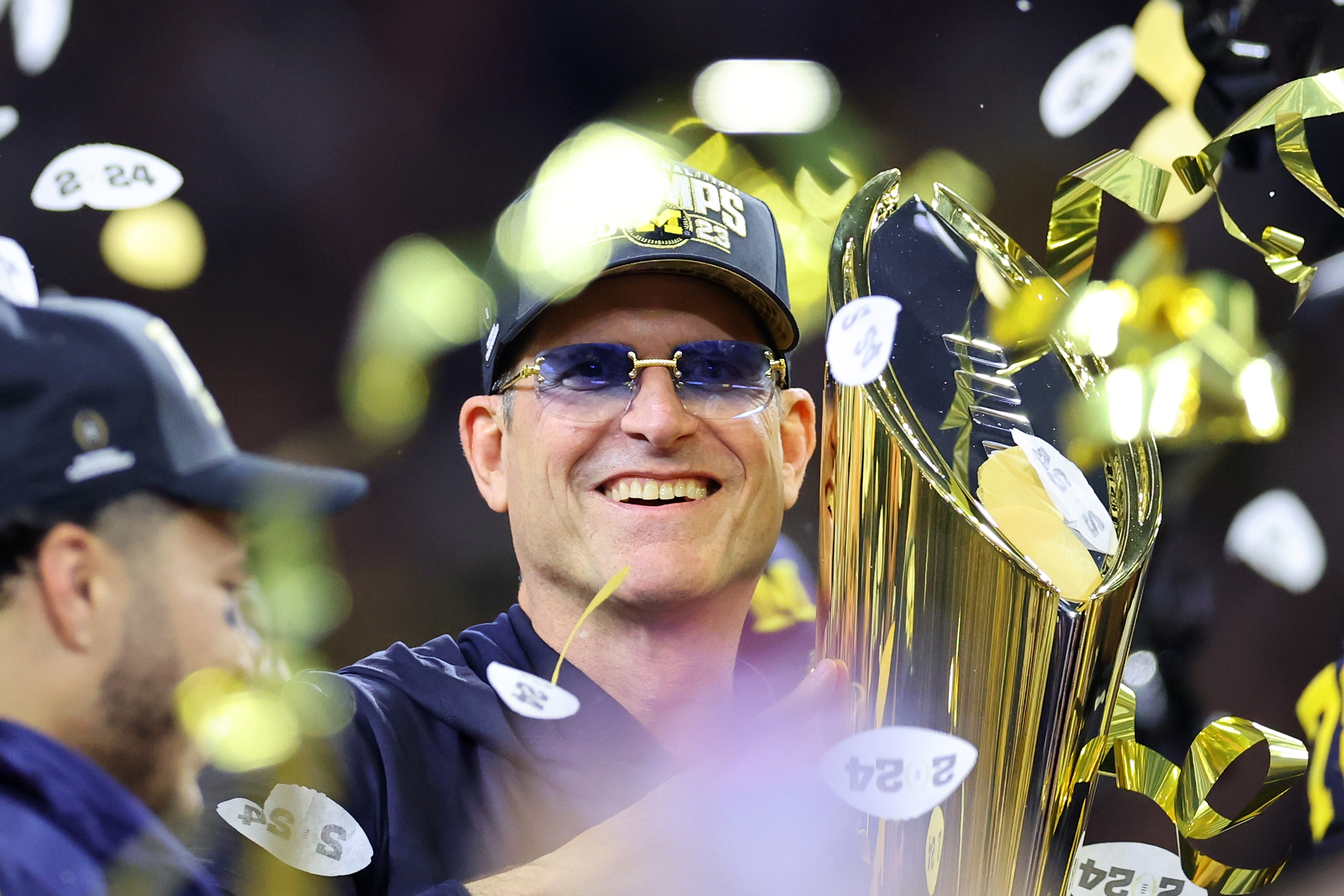 HOUSTON, TEXAS - JANUARY 08: Head coach Jim Harbaugh of the Michigan Wolverines celebrates after defeating the Washington Huskies during the 2024 CFP National Championship game at NRG Stadium on January 08, 2024 in Houston, Texas.  Michigan defeated Washington 34-13. 