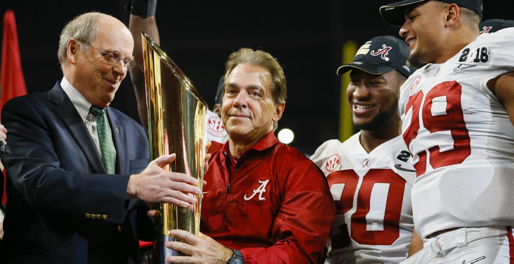ATLANTA, GA - JANUARY 08: Alabama Crimson Tide head coach Nick Saban receives the CFP trophy during the trophy presentation at the conclusion of the College Football Playoff National Championship Game between the Alabama Crimson Tide and the Georgia Bulldogs on January 8, 2018 at Mercedes-Benz Stadium in Atlanta, GA. The Alabama Crimson Tide won the game in overtime 26-23.