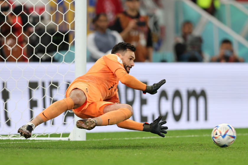 Hugo Lloris of France saves a penalty from Robert Lewandowski of Poland prior to it being retaken due to the goalkeeper leaving his goal line during the FIFA World Cup Qatar 2022 Round of 16 match between France and Poland
