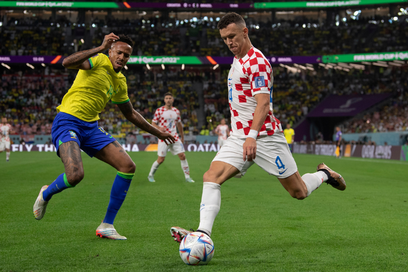 Eder Militao of Brazil and Ivan Perisic of Croatia in action during the FIFA World Cup Qatar 2022 quarter final match between Croatia and Brazil
