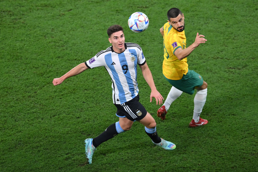 Julian Alvarez of Argentina battles for possession with Aziz Behich of Australia during the FIFA World Cup Qatar 2022 Round of 16 match between Argentina and Australia at Ahmad Bin Ali Stadium