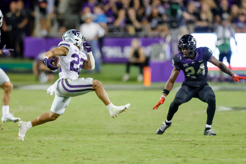 Kansas State Wildcats running back Deuce Vaughn (22) tries to run through the line of scrimmage during the game between the TCU Horned Frogs and the Kansas State Wildcats