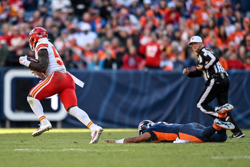 Kansas City Chiefs linebacker Willie Gay (50) breaks free from a tackle attempt bny Denver Broncos quarterback Russell Wilson (3) after intercepting a pass