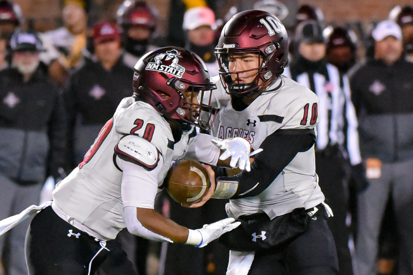 Diego Pavia (10) hands off to running back Tim Gans (20) during a non conference game between the New Mexico State Aggies and the Missouri Tiger