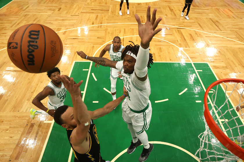 Robert Williams III #44 of the Boston Celtics blocks a shot against Stephen Curry #30 of the Golden State Warriors in the first half during Game Four of the 2022 NBA Finals at TD Garden