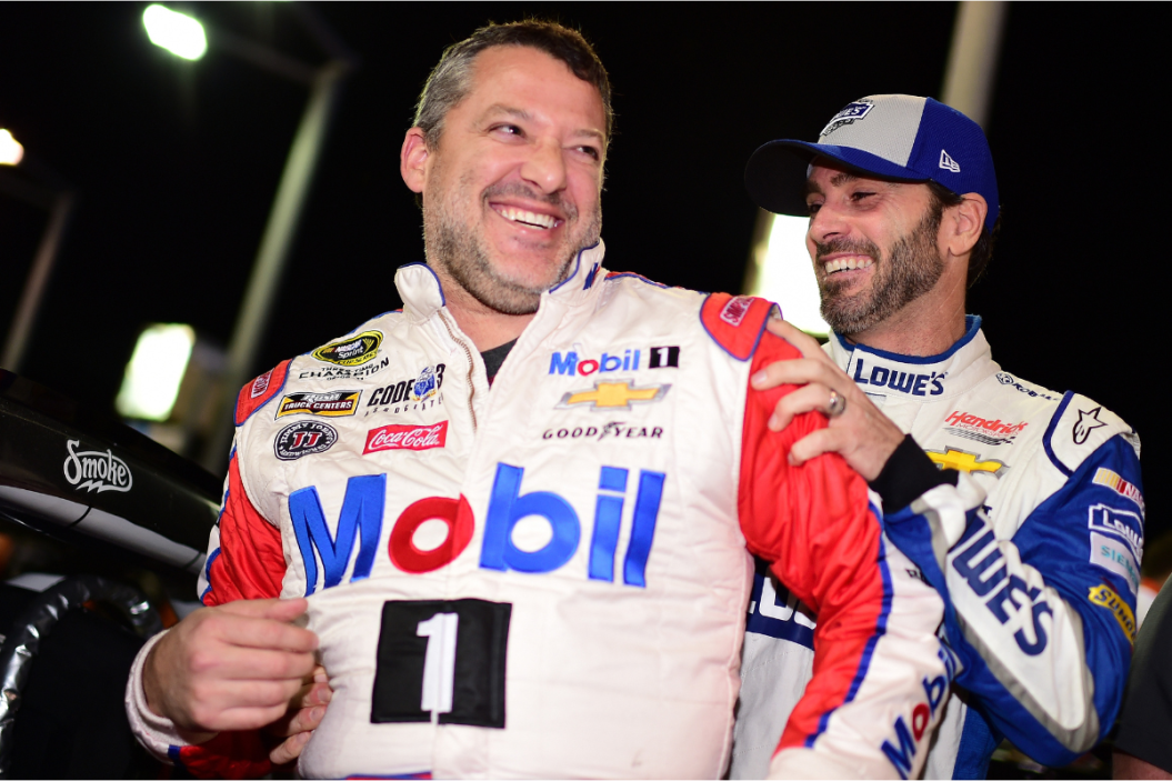 Tony Stewart and Jimmie Johnson joke around on the grid during qualifying for the 2016 Ford EcoBoost 400 at Homestead-Miami Speedway